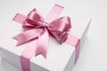 Gift box with pink bow on light grey background, closeup Royalty Free Stock Photo