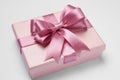 Gift box with pink bow on light grey background, closeup Royalty Free Stock Photo