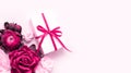 Gift box present decorations flatlay. Gift, pink ribbon, pink flowers top view. Congratulation template long banner