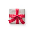 Gift box present isolated with clipping path with red bow satin ribbon over brown wrapping paper on white background Royalty Free Stock Photo