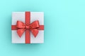 Gift box or present box with red ribbon and bow isolated on green blue pastel color background Royalty Free Stock Photo