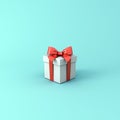 Gift box or Present box with red ribbon and bow isolated on light blue green pastel color background Royalty Free Stock Photo