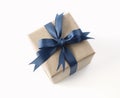 Gift box, present wrap with blue ribbon and bow top view on white background Royalty Free Stock Photo