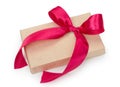 Gift box with presents wrapped in kraft paper with red bow isolated on the white background Royalty Free Stock Photo