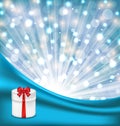 Gift box with red bow on glowing background