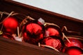 Gift box with red Christmas toys and Christmas trChristmas decorations in a beautiful box, red balls in the snow. Christmas decor Royalty Free Stock Photo