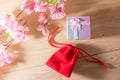 Gift box and Red Gift Bag wrapped and plum blossom Christmas and Newyear presents with bows and ribbons, Christmas frame boxing. Royalty Free Stock Photo