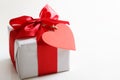 Gift box with red heart tag Royalty Free Stock Photo