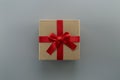 gift box with red ribbon closeup on gray background, Royalty Free Stock Photo