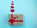 Gift box hearts on blue. Valentine's day concept.