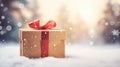 Gift box with red ribbon on snow with bokeh background Royalty Free Stock Photo