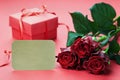 Gift box, red roses flowers and empty paper note Royalty Free Stock Photo