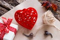Gift box, red velvet heart on paper