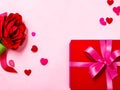 Gift box with ribbon and flower, hearts on the background. With copy space. Generative AI