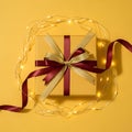 Gift Box with Ribbon and Lights Royalty Free Stock Photo