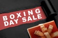 Gift box with a ripped paper showing Boxing Day Sale text Royalty Free Stock Photo