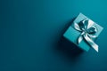 Gift box with satin ribbon and bow on blue background. Holiday gift with copy space. AI generated. Royalty Free Stock Photo