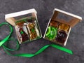 Gift box with set of different dried fruits nuts individually wrapped flat lay. Healthy food diet. Christmas celebration