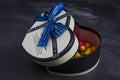 Gift box in the shape of heart with sweets inside