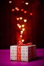Gift box shaped heart with Defocused bokeh colorful lights Royalty Free Stock Photo