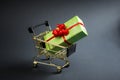 Gift box in shop cart for special day, buy present, sell present, valentine gift, Christmas holidays or other