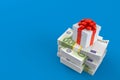 Gift box on stack of money Royalty Free Stock Photo