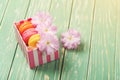 Gift box with three french macaroons and sakura flowers. Copy sp