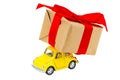 Gift box on toy retro car on white background. Christmas holiday Royalty Free Stock Photo