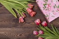 Gift box and tulip flowers on rustic table for March 8, International Womens day, Birthday or Mothers day, beautiful Royalty Free Stock Photo