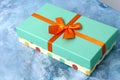 Gift box turquoise with satin ribbon Royalty Free Stock Photo