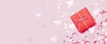 Gift box vith red bow and glitter sparkles on pink background. st. Valentine`s day concept Royalty Free Stock Photo