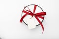 Gift box on a white background with a postcard. layout. gift round white box with a red bow on a light background in a row. Royalty Free Stock Photo