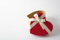 Gift box on the white background. Red ribbon. Valentines Day .