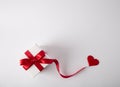 Gift box on the white background. Red ribbon. Valentines Day gift. .