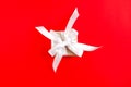 Gift box with a white ribbon and a bow on the red background. Close-up. Top view. Banner Royalty Free Stock Photo