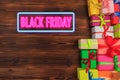 Gift box on a wooden background top view. Black friday sale Royalty Free Stock Photo