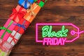 Gift box on a wooden background top view. Black friday sale Royalty Free Stock Photo