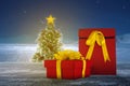 Gift box on a wooden table with a Christmas tree with a snowfall background