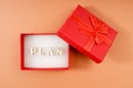 In a gift box, a word made up of wooden letters - a plan