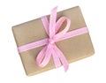 Gift box wrapped in brown recycled paper with pink ribbon top vi Royalty Free Stock Photo