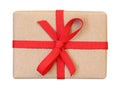 Gift box wrapped in brown recycled paper with red ribbon bow top view isolated on white, path Royalty Free Stock Photo