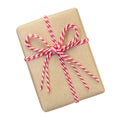 Gift box wrapped in brown recycled paper with red and white rope