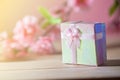 Gift box wrapped and plum blossom Christmas and Newyear presents with bows and ribbons, Christmas frame boxing day background. Royalty Free Stock Photo