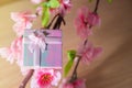 Gift box wrapped and plum blossom Christmas and Newyear presents with bows and ribbons, Christmas frame boxing day background. Royalty Free Stock Photo