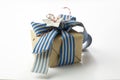 Gift box wrapped in recycled paper, blue ribbon bow Royalty Free Stock Photo