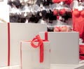 Gift boxes on the background of a lingerie store. Advertising, sales, fashion concept Royalty Free Stock Photo