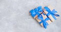 Gift boxes with a blue bow on concrete background. Banner. Copy space. Flat lay. Top view. The concept of any holiday Royalty Free Stock Photo