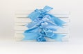 Gift boxes with blue ribbons on a white background Royalty Free Stock Photo