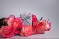 Gift boxes. Bouquet of pink roses. Jewelry boxes. Pink roses lie on the table. Bouquet of flowers. Present. Royalty Free Stock Photo