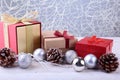 Gift boxes with bow and christmas balls on wood background. Decoration Royalty Free Stock Photo